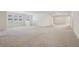 Spacious bonus room with neutral carpeting and multiple windows at 8833 Corcovado Dr, Kissimmee, FL 34747