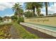 Gated community entrance with water feature and landscaping at 8833 Corcovado Dr, Kissimmee, FL 34747