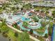 Large community pool with lazy river and water features at 8833 Corcovado Dr, Kissimmee, FL 34747