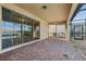 Screened patio with brick pavers overlooking the pool at 8833 Corcovado Dr, Kissimmee, FL 34747