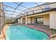 Inviting pool area with covered patio and spa at 8833 Corcovado Dr, Kissimmee, FL 34747