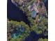 Aerial view showing house, pool, and tennis court at 89 Crooked Pine Rd, Port Orange, FL 32128