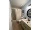 Bathroom with tub, toilet and updated vanity at 89 Crooked Pine Rd, Port Orange, FL 32128
