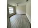 Bright bedroom with ceiling fan and wood-look flooring at 89 Crooked Pine Rd, Port Orange, FL 32128