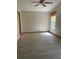 Bright bedroom with light wood-look floors and ceiling fan at 89 Crooked Pine Rd, Port Orange, FL 32128