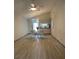 Dining area with light wood-look floors and a view into the kitchen at 89 Crooked Pine Rd, Port Orange, FL 32128