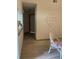 Light beige hallway with light wood-look tile flooring at 89 Crooked Pine Rd, Port Orange, FL 32128