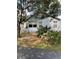 Light blue house exterior with small deck and landscaping at 89 Crooked Pine Rd, Port Orange, FL 32128