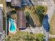 House with kidney-shaped pool, viewed from above at 911 Shady Park Ter, Daytona Beach, FL 32117