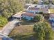 Aerial view of home with carport and yard at 911 Shady Park Ter, Daytona Beach, FL 32117