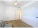 Simple bedroom with a gray couch and whiteboard at 911 Shady Park Ter, Daytona Beach, FL 32117