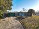 Ranch-style home with carport and landscaped yard at 911 Shady Park Ter, Daytona Beach, FL 32117