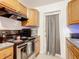Kitchen with stainless steel range and oak cabinets at 911 Shady Park Ter, Daytona Beach, FL 32117
