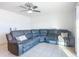 Living room with sectional sofa and ceiling fan at 911 Shady Park Ter, Daytona Beach, FL 32117