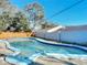 Kidney shaped swimming pool in backyard at 911 Shady Park Ter, Daytona Beach, FL 32117