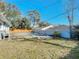 Backyard pool with surrounding trees at 911 Shady Park Ter, Daytona Beach, FL 32117