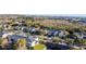 Aerial view of townhouses and community with pond at 9746 Tiramasu Trl, Orlando, FL 32829