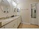 Modern bathroom with double vanity and granite countertop at 9746 Tiramasu Trl, Orlando, FL 32829