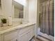 Bathroom with granite countertop and walk-in shower at 9746 Tiramasu Trl, Orlando, FL 32829