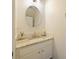 Small bathroom with granite countertop and round mirror at 9746 Tiramasu Trl, Orlando, FL 32829