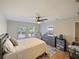 Spacious bedroom with wood floors and large windows at 9746 Tiramasu Trl, Orlando, FL 32829