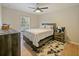 Bedroom with a queen-size bed and plenty of natural light at 9746 Tiramasu Trl, Orlando, FL 32829