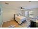 Bright bedroom with wood floors and ceiling fan at 9746 Tiramasu Trl, Orlando, FL 32829