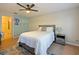 Cozy bedroom with wood floors and ceiling fan at 9746 Tiramasu Trl, Orlando, FL 32829