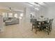Open concept dining room with table and kitchen views at 9746 Tiramasu Trl, Orlando, FL 32829