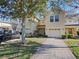 Two-story townhouse with attached garage at 9746 Tiramasu Trl, Orlando, FL 32829