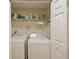 Laundry room with washer, dryer, and shelving at 9746 Tiramasu Trl, Orlando, FL 32829