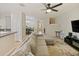 Open concept living area with sectional sofa and kitchen at 9746 Tiramasu Trl, Orlando, FL 32829