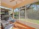 Cozy screened porch with patio furniture at 9746 Tiramasu Trl, Orlando, FL 32829