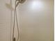 Walk in shower with textured wall tiles at 9746 Tiramasu Trl, Orlando, FL 32829