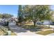 House with a spacious yard, driveway, and neighboring houses visible at 1921 Nicholas Pl, St Cloud, FL 34771