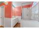 Coral-toned bathroom with walk-in shower and updated vanity at 1921 Nicholas Pl, St Cloud, FL 34771