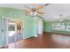 Spacious living area with wood floors and access to backyard patio at 1921 Nicholas Pl, St Cloud, FL 34771