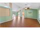 Spacious living room with light walls, wood flooring and ceiling fan at 1921 Nicholas Pl, St Cloud, FL 34771