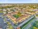 An aerial view of an apartment complex showcasing its layout and landscaping at 1000 Lake Of The Woods Blvd # 203E, Casselberry, FL 32730