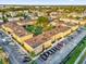 Aerial view showing apartment buildings, parking, and a courtyard at 1000 Lake Of The Woods Blvd # 203E, Casselberry, FL 32730
