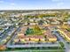 Aerial view of apartment complex with parking and surrounding neighborhood at 1000 Lake Of The Woods Blvd # 203E, Casselberry, FL 32730