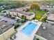 Aerial view of community pool and building at 1000 Lake Of The Woods Blvd # 203E, Casselberry, FL 32730
