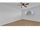 Bright bedroom with ceiling fan and wood-look floors at 1000 Lake Of The Woods Blvd # 203E, Casselberry, FL 32730