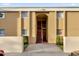 Exterior view of apartment building entrance with stairs and landscaping at 1000 Lake Of The Woods Blvd # 203E, Casselberry, FL 32730