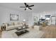 Bright and airy living room with modern decor and open floor plan to the dining area at 1000 Lake Of The Woods Blvd # 203E, Casselberry, FL 32730