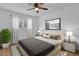Cozy main bedroom featuring a comfortable bed, soft lighting, and tasteful decor at 1000 Lake Of The Woods Blvd # 203E, Casselberry, FL 32730