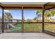 Screened porch overlooking grassy courtyard at 1000 Lake Of The Woods Blvd # 203E, Casselberry, FL 32730