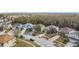 Aerial view of a residential neighborhood with houses and street at 1176 Liberty Hall Dr, Kissimmee, FL 34746