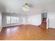 Bright living room with wood floors and a staircase at 1176 Liberty Hall Dr, Kissimmee, FL 34746