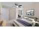 Bedroom with bed, desk, and abstract wall decor at 1216 Priory Cir, Winter Garden, FL 34787